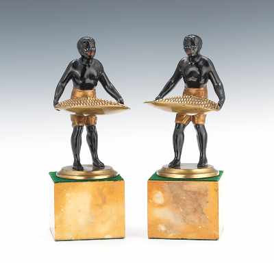 Appraisal: Pair Blackamoors with Baskets Male figures with polychrome enamels holding