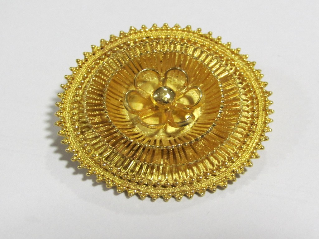 Appraisal: African gold circular flower brooch test for carats Approximately gms