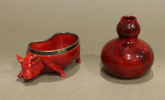 Appraisal: A Royal Doulton Flamb pig salt with silver rim cm