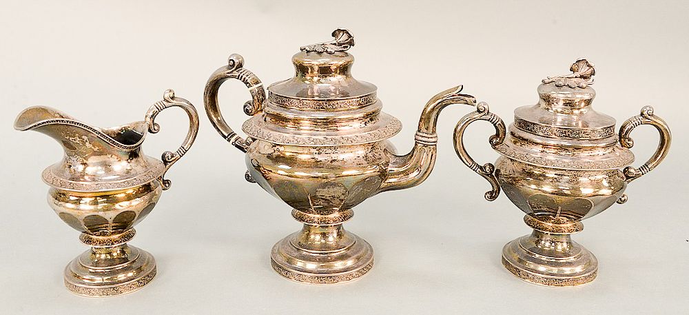 Appraisal: Federal silver three piece tea set with floral finial early