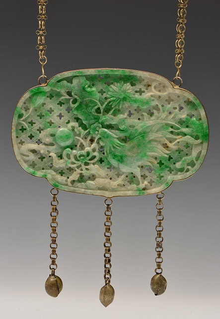 Appraisal: A CHINESE METAL MOUNTED EMERALD GREEN AND WHITE JADE QUATREFOIL