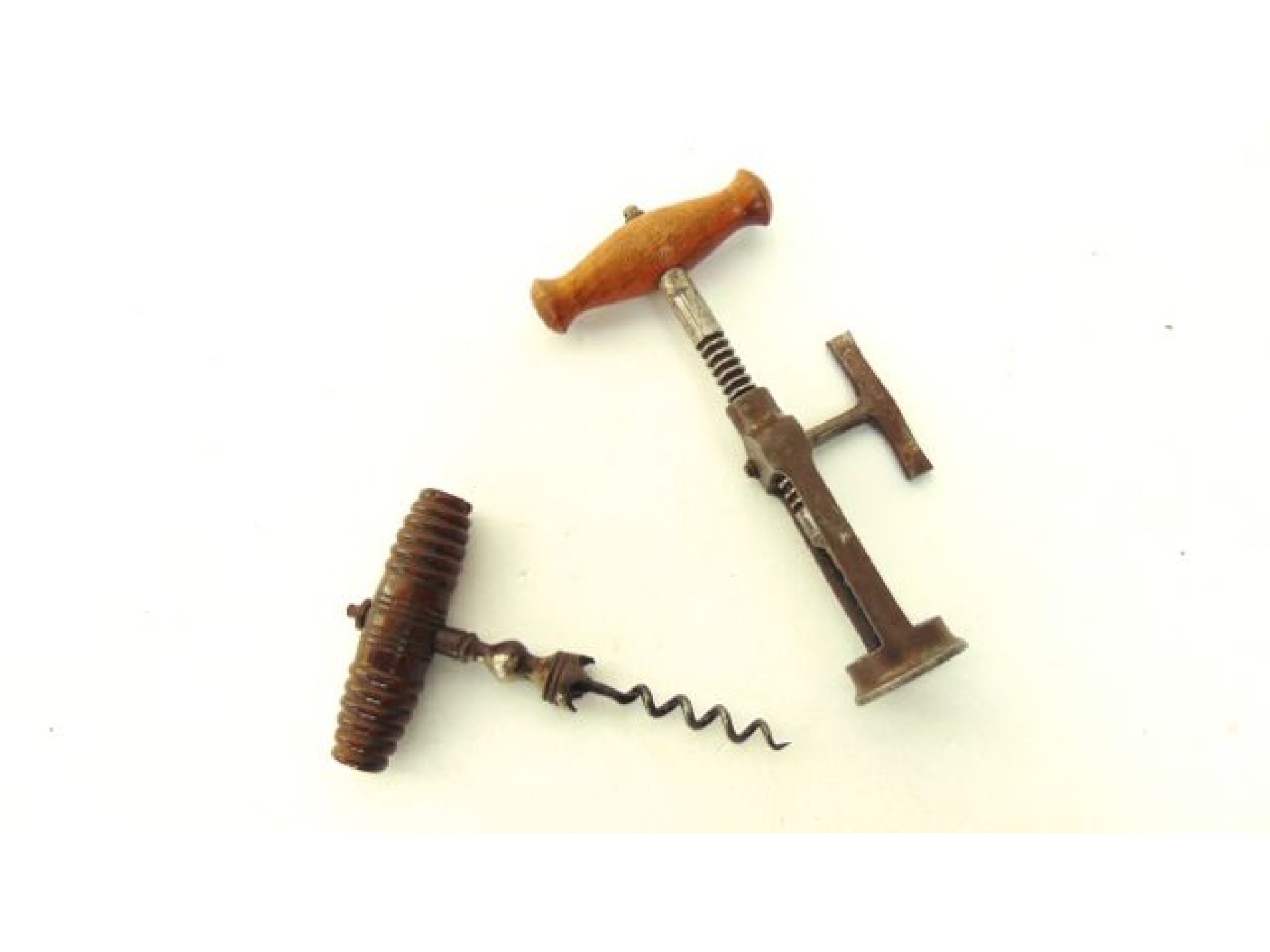 Appraisal: A mechanical corkscrew and a th century corkscrew with turned