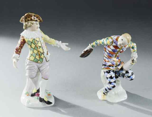 Appraisal: TWO DRESDEN PORCELAIN COURT JESTER FIGURINES the first standing leaning