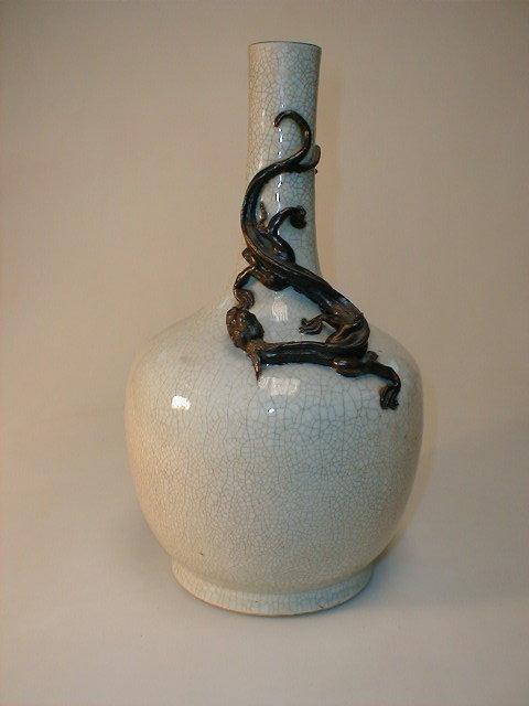 Appraisal: A Japanese crackle glaze bottle vase with applied dragon to