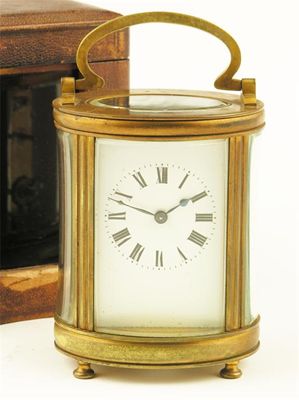 Appraisal: A French gilt brass oval carriage clock with a platform