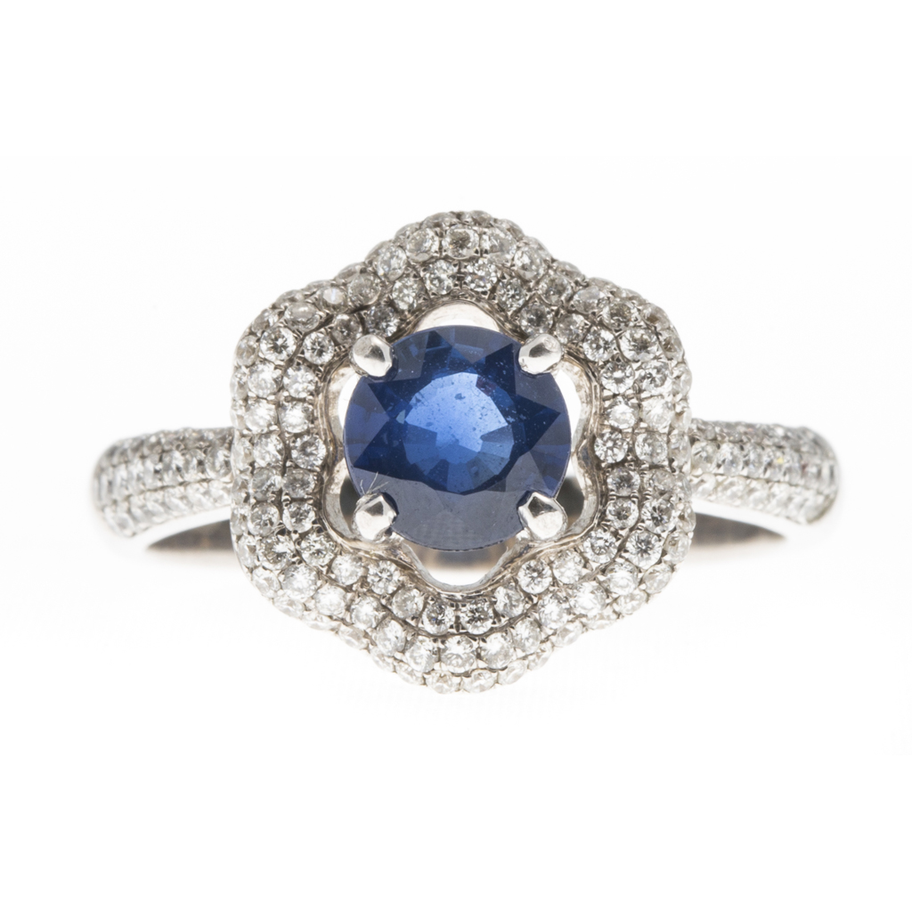 Appraisal: An ct white gold sapphire and diamond set cluster ring