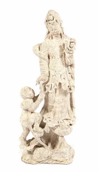 Appraisal: A Chinese carved stone figure of Guanyin and the boy