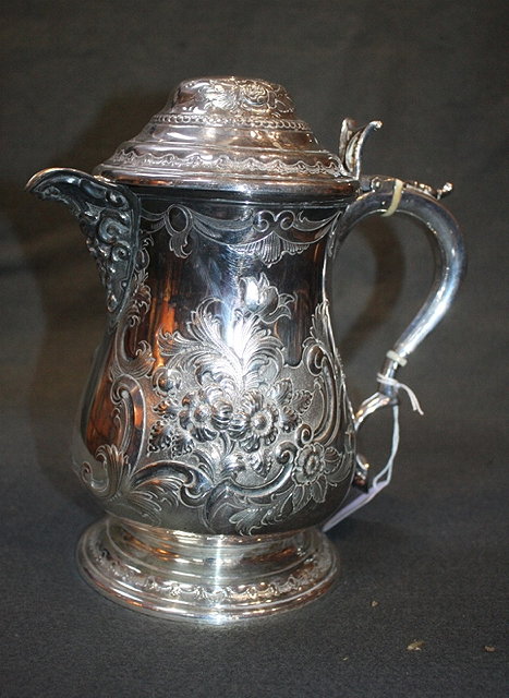 Appraisal: A LATE GEORGIAN STYLE SILVER PLATED JUG with foliate and