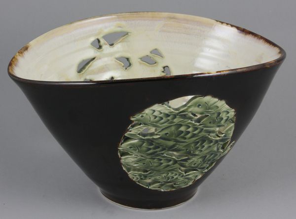 Appraisal: Oval brown glazed bowl with pierced sides decorated with green