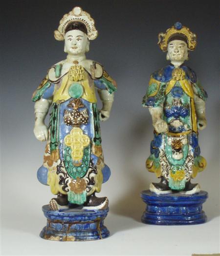 Appraisal: A pair of th century Chinese glazed pottery figures of