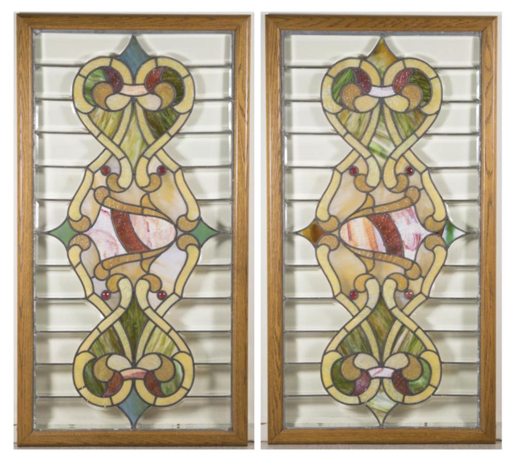 Appraisal: A PAIR OF STAINED LEADED AND BEVELED GLASS WINDOWS in