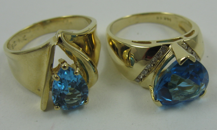 Appraisal: TWO BLUE TOPAZ RINGS both with K yellow gold settings