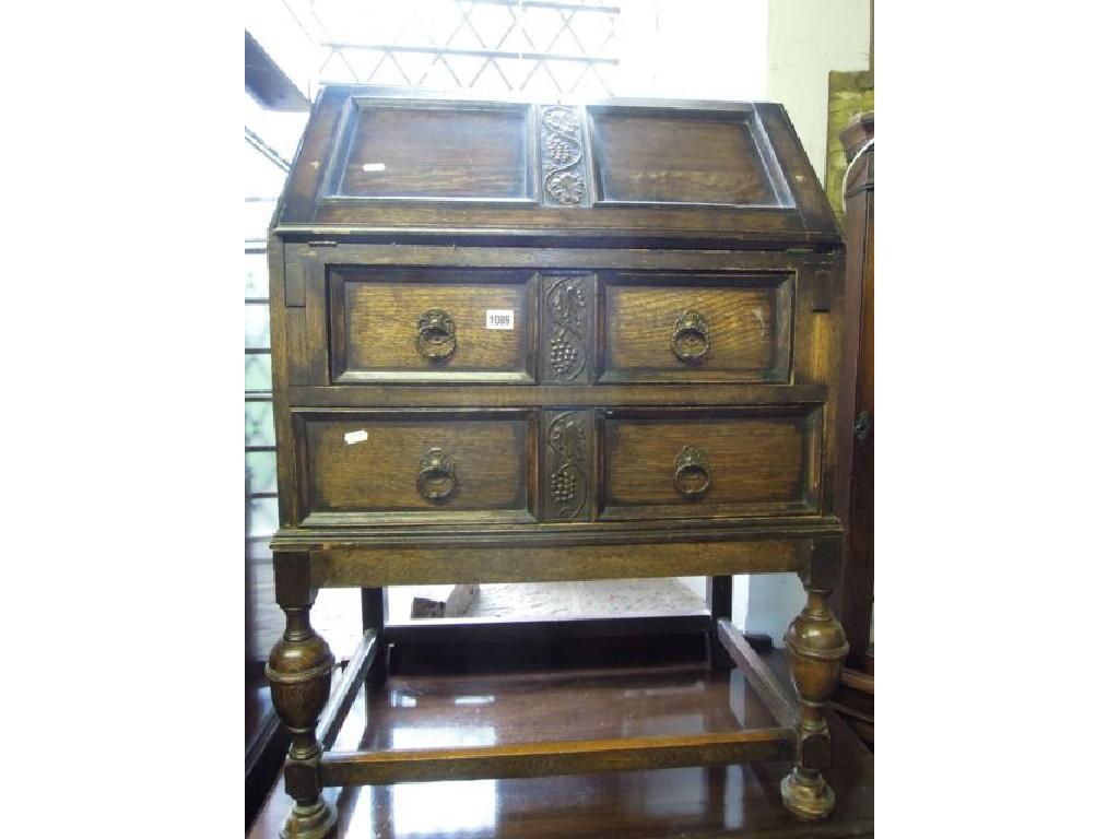 Appraisal: An Edwardian 's oak bureau the twin panelled fall front