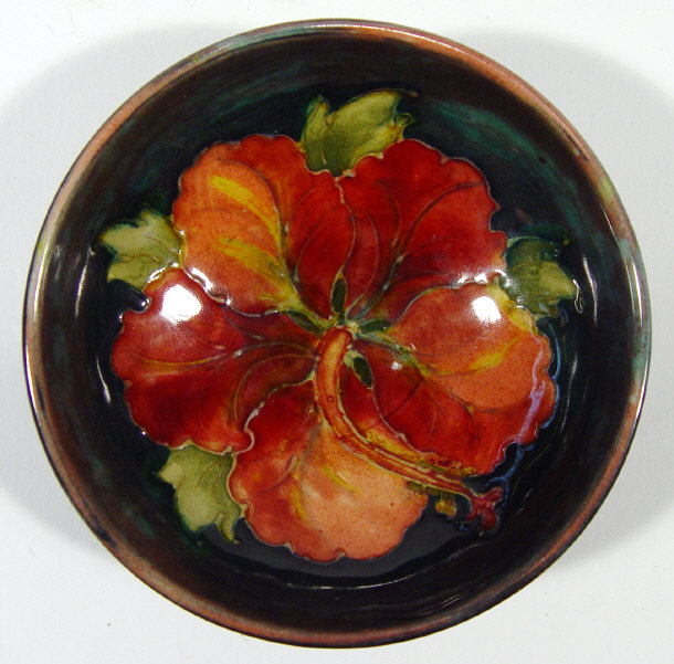 Appraisal: Moorcroft pottery pin dish hand painted and tubelined with a