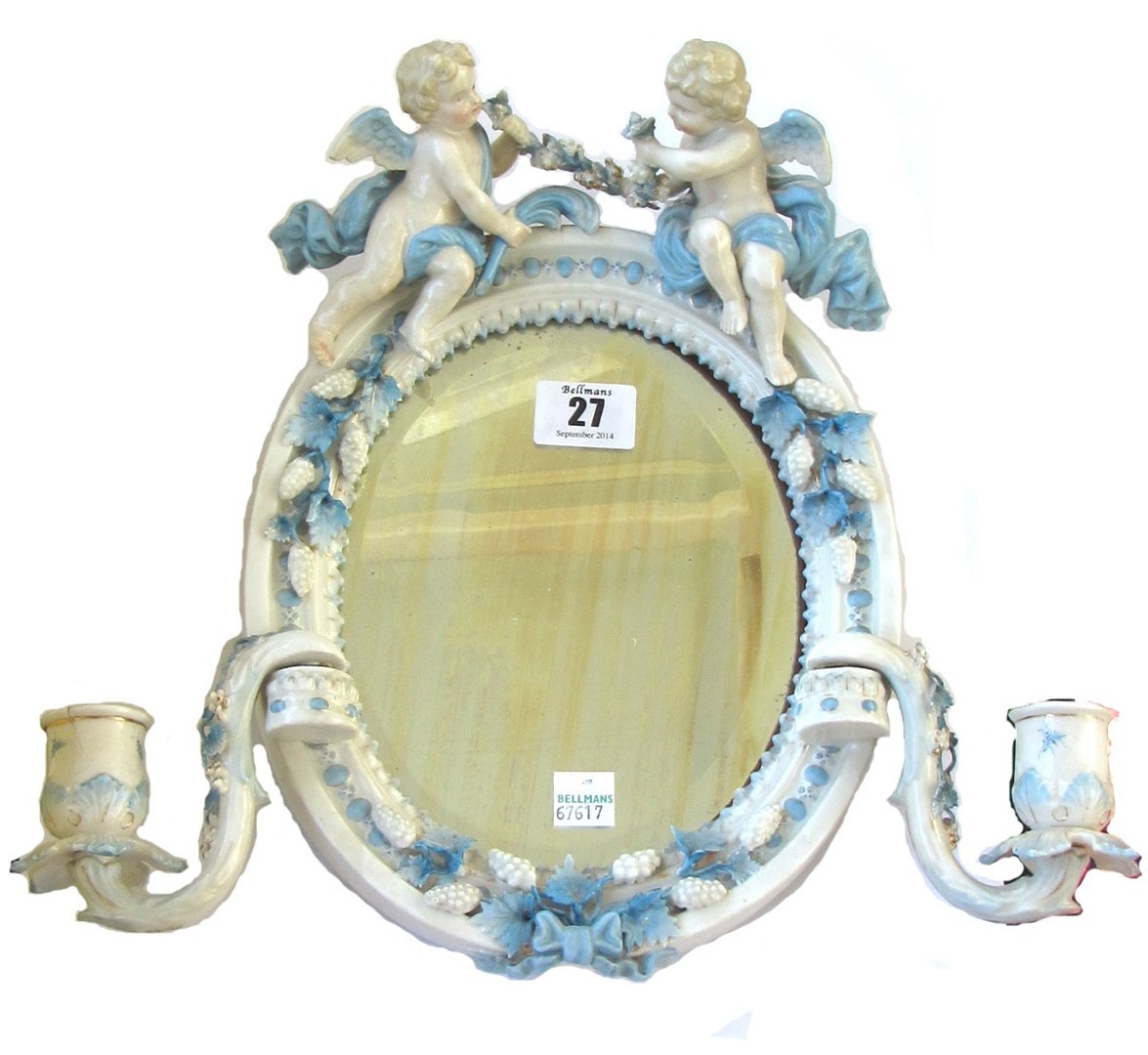 Appraisal: A small Sitzendorf oval blue and white wall mirror late