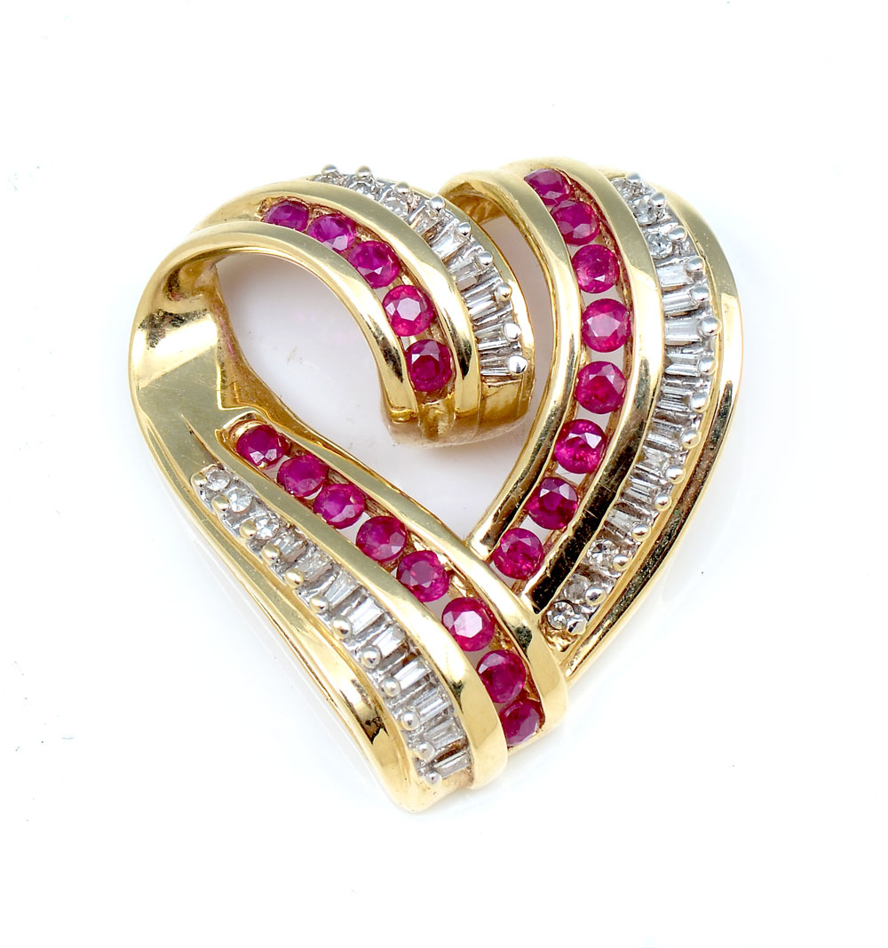 Appraisal: K HEART PENDANT WITH RUBIES DIAMONDS Stylized heart slide pendant