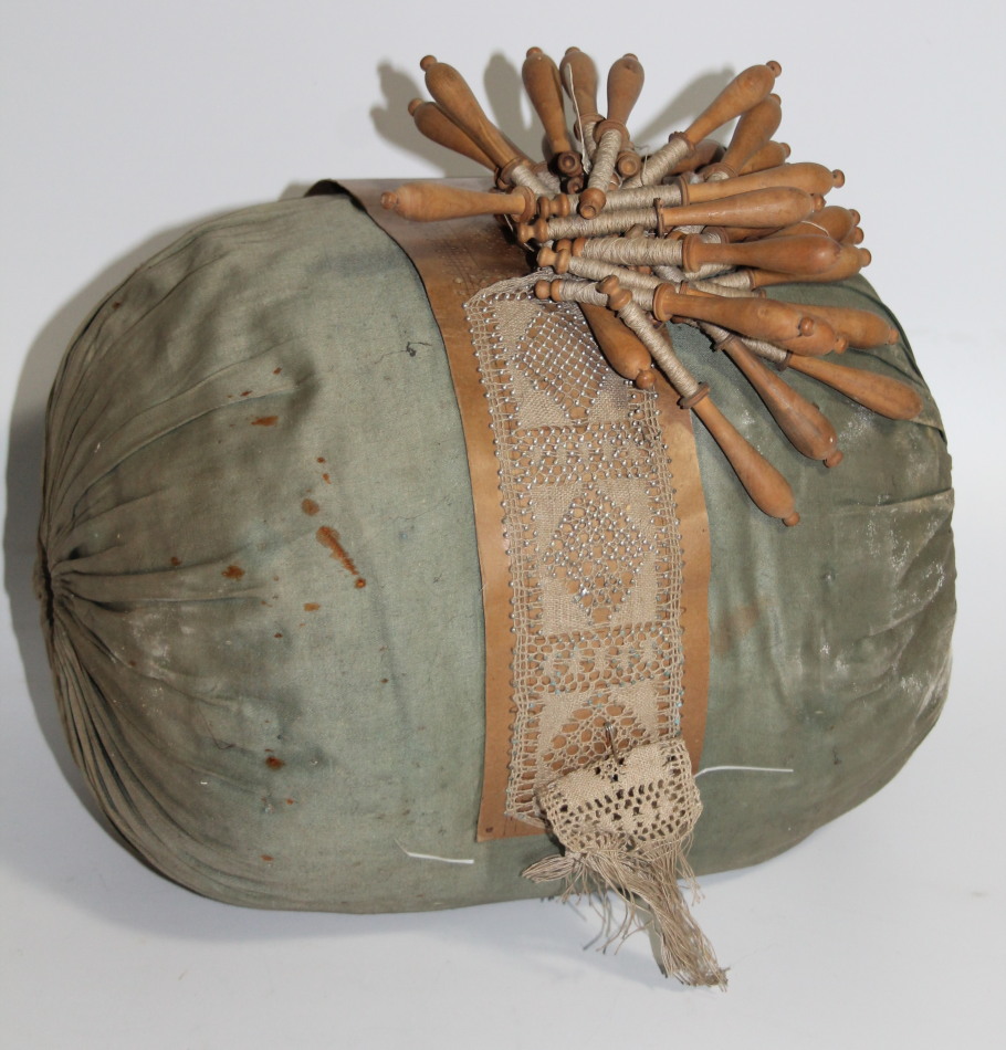 Appraisal: An early Victorian lacemaker's cushion and bobbins