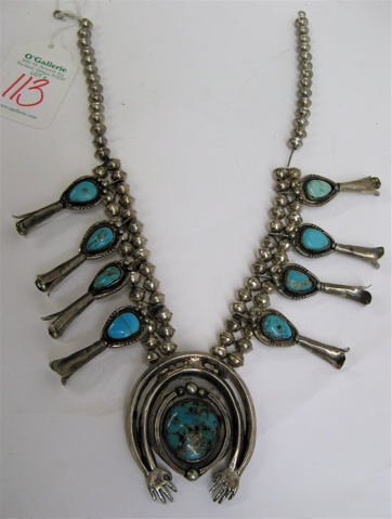 Appraisal: NAVAJO NATIVE AMERICAN SQUASH BLOSSOM NECKLACE inset with turquoise in