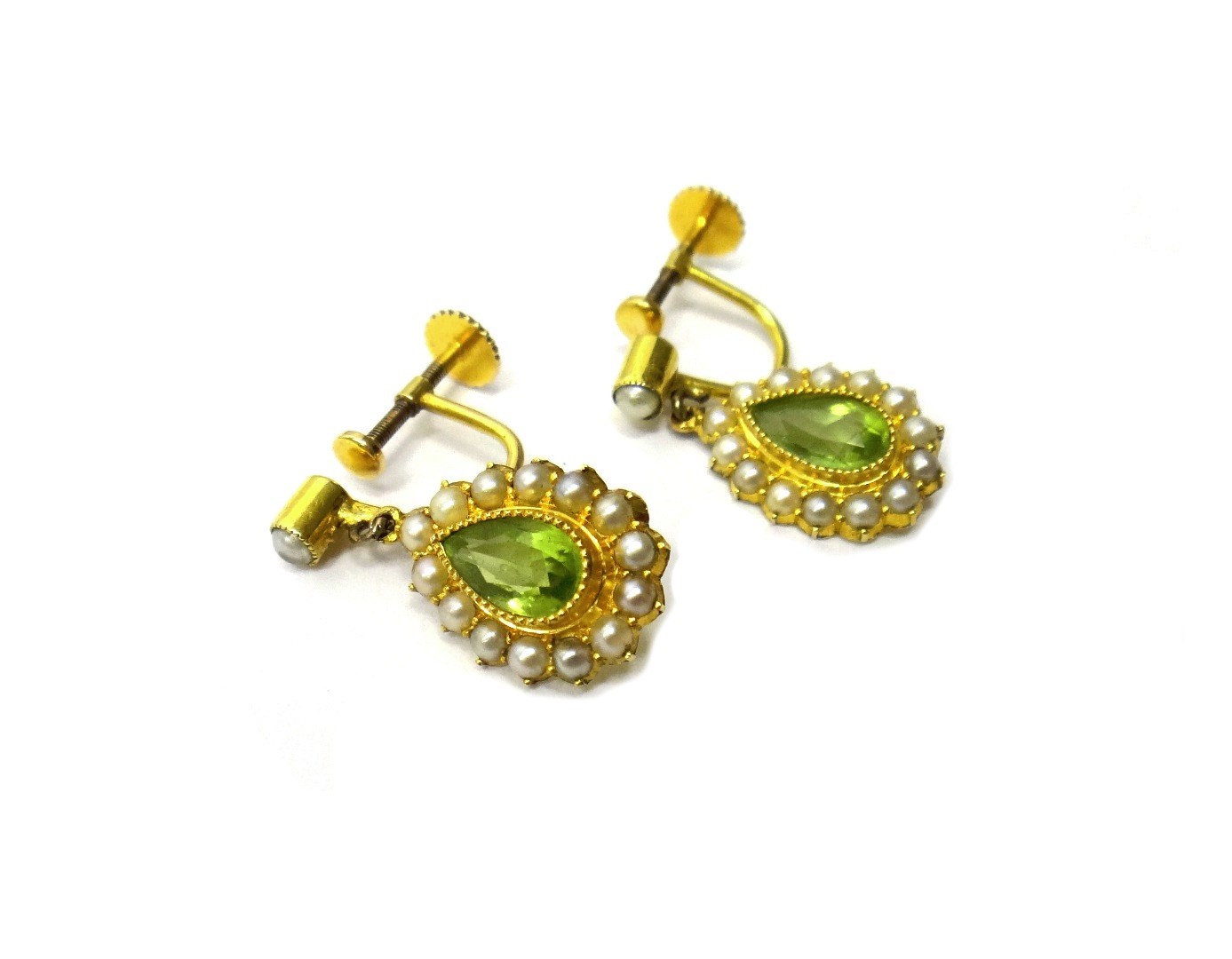 Appraisal: A pair of gold peridot and seed pearl set earrings