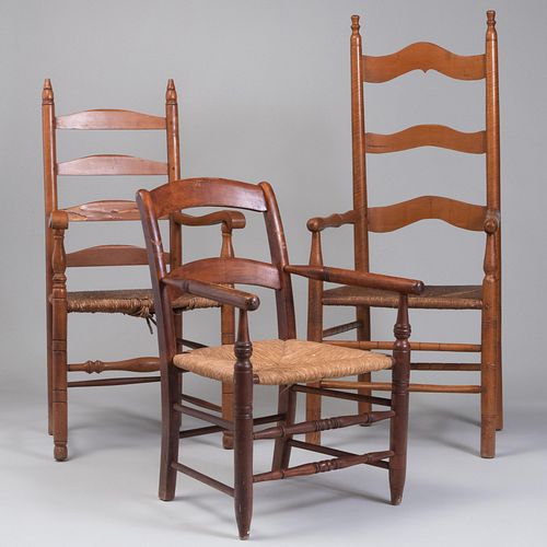 Appraisal: TWO AMERICAN MAPLE AND RUSH LADDER BACK ARMCHAIRSTogether with a