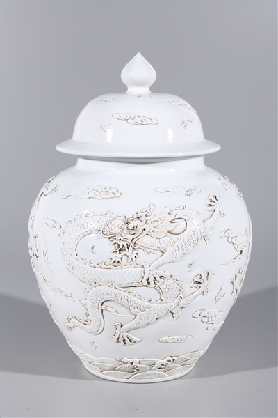 Appraisal: Chinese white glazed covered vase with dragons and flaming pearls