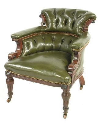 Appraisal: A late Victorian mahogany and ebony tub armchair the later