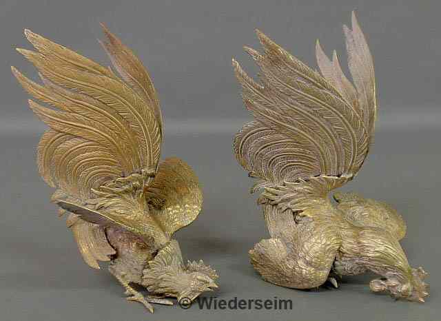 Appraisal: Pair of Continental brass fighting roosters th c h x