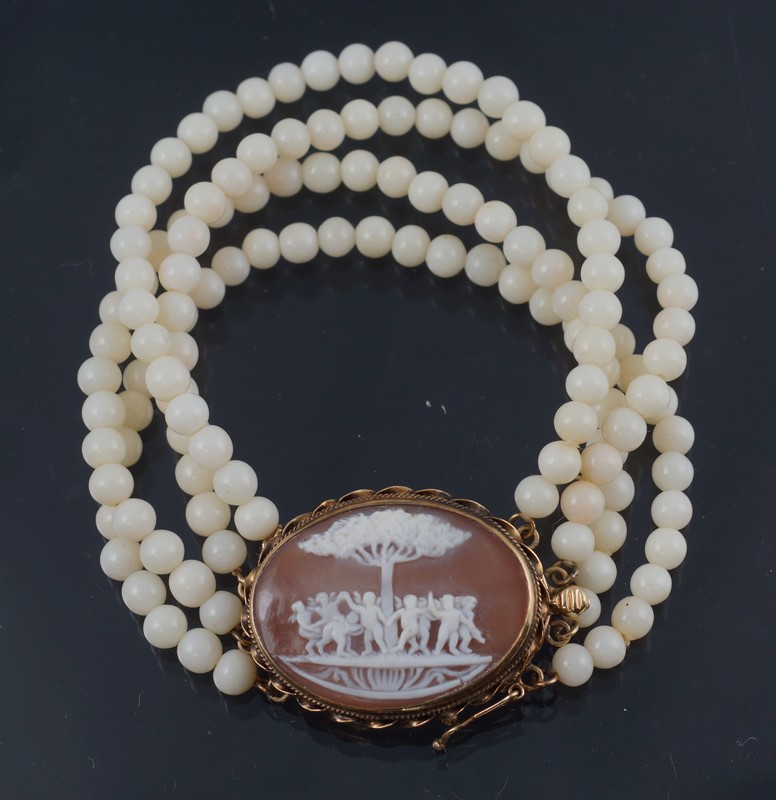 Appraisal: K YG carved shell cameo row white beaded bracelet stamped