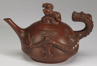 Appraisal: Chinese Yixing dragon horse teapot h Chinese Yixing teapot having