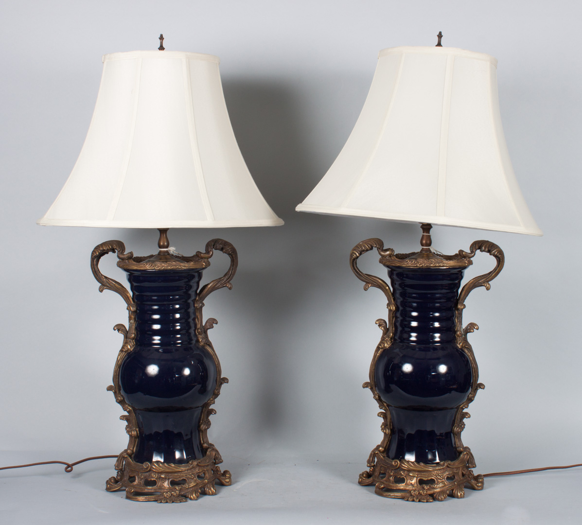 Appraisal: Pair of bronze-mounted porcelain vase lamps bleu du roi ku-form