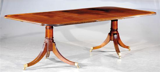 Appraisal: Regency style two-pillar inlaid mahogany dining table crossbanded banquet ends