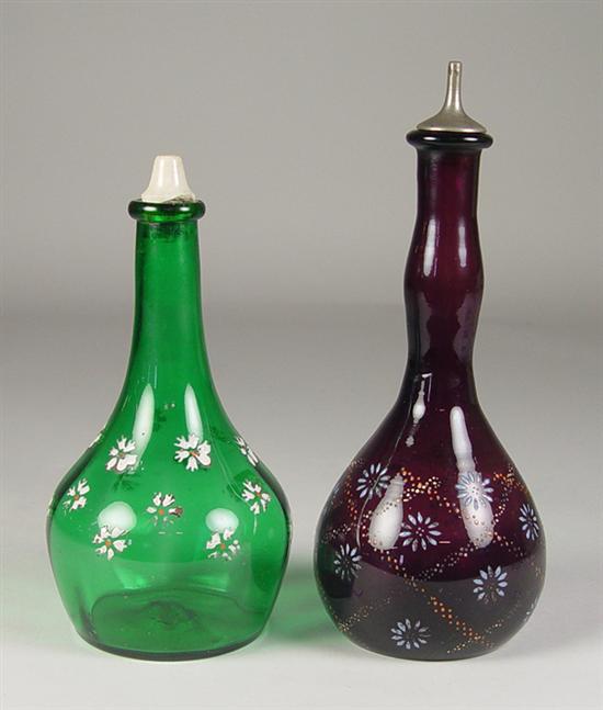 Appraisal: Two Decorated Barber Bottles Mid th Century One dark amethyst