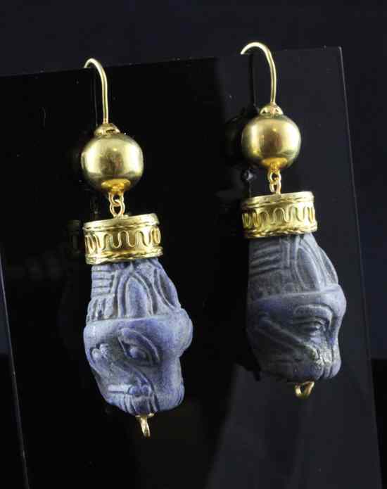 Appraisal: A pair of antique style gold mounted lapis lazuli Assyria