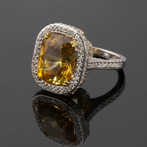 Appraisal: A golden sapphire colored diamond and diamond ring mounted in