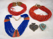 Appraisal: A mixed lot comprising three ethnic necklaces and two white