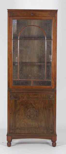 Appraisal: An Edwardian bookcase the upper section with glazed panel door