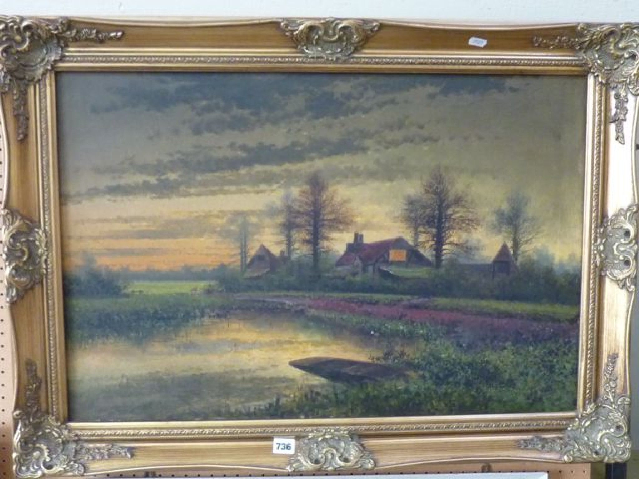 Appraisal: An oil painting on board of a river landscape at