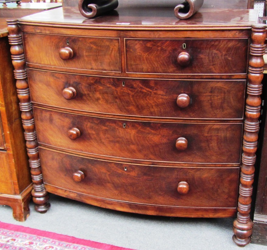 Appraisal: A Regency mahogany bow front chest of two short and