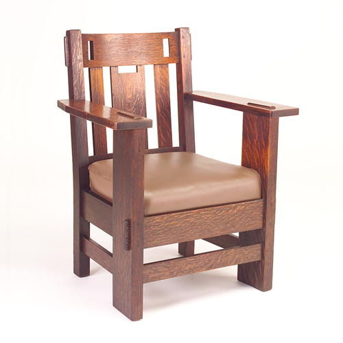 Appraisal: CHARLES STICKLEY Heavy armchair with broad plank legs mortised through