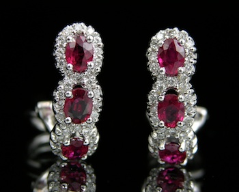 Appraisal: A Pair of Ruby and Diamond Omega Earrings k white