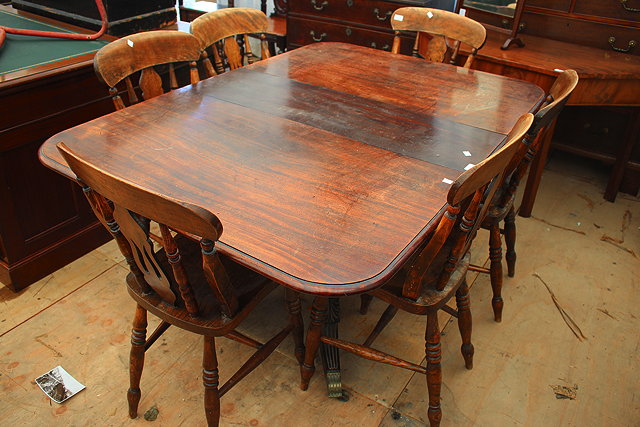 Appraisal: A TH CENTURY MAHOGANY DRAWER LEAF DINING TABLE on central