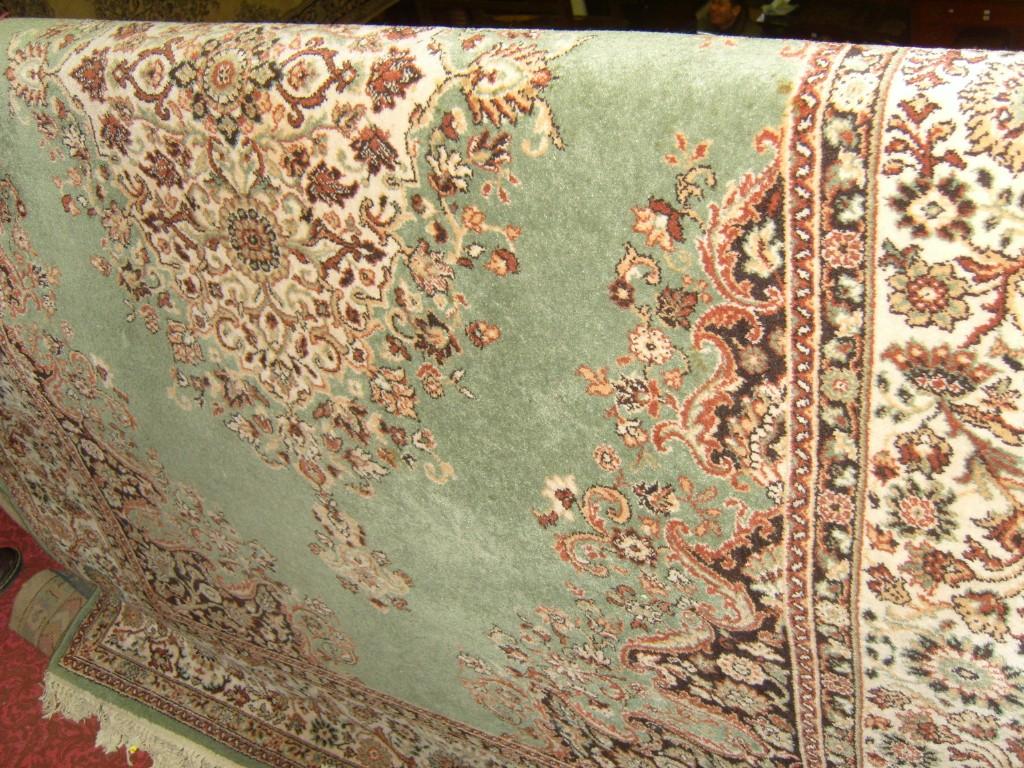 Appraisal: A green ground wool carpet with Persian style decoration in