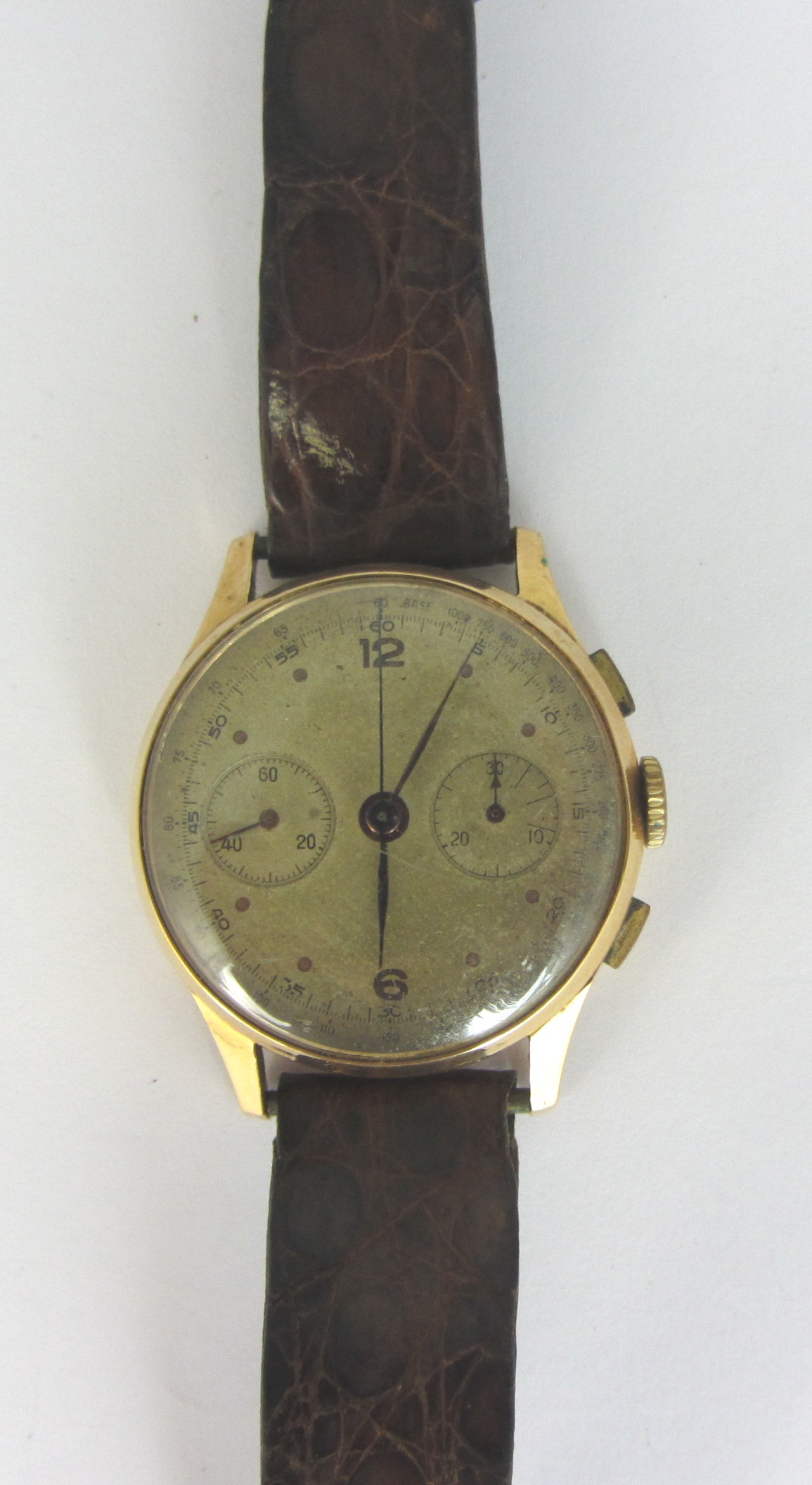 Appraisal: A gentleman's gold circular cased chronograph wristwatch the unsigned dial