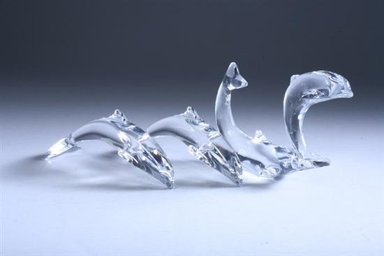 Appraisal: FOUR BACCARAT CRYSTAL DOLPHINS - in long largest