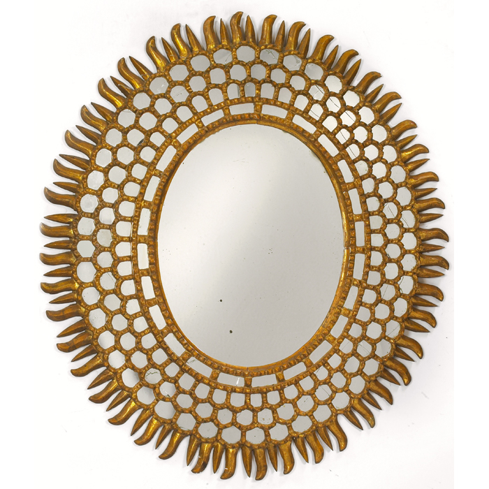 Appraisal: Decorative mirror s hand-carved sunburst form with carved sections to