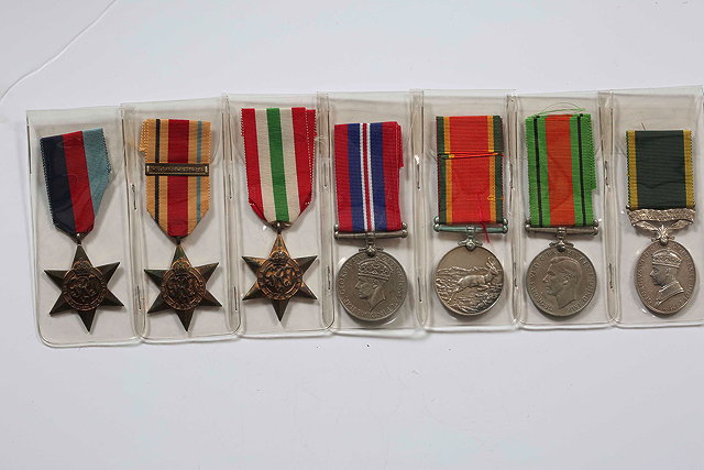 Appraisal: A GROUP OF MEDALS awarded to J W Rayburn consisting