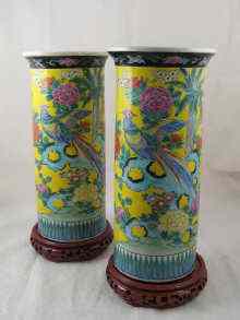 Appraisal: A pair of Chinese vases on wooden stands decorated with