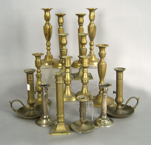 Appraisal: Fourteen brass candlesticks together with a pair of weighted silver