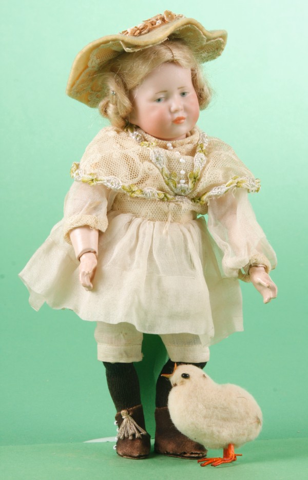 Appraisal: K R character child doll Painted blue eyes closed mouth