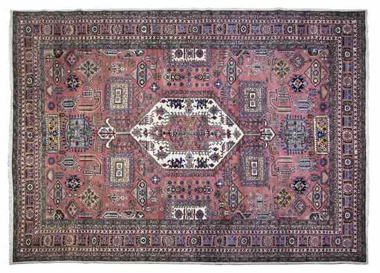 Appraisal: A Northwest Persian Wool Rug centered by an ivory lozenge